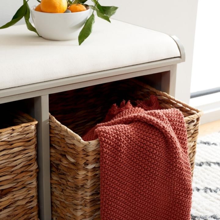 Gray Bench with Woven Storage Baskets